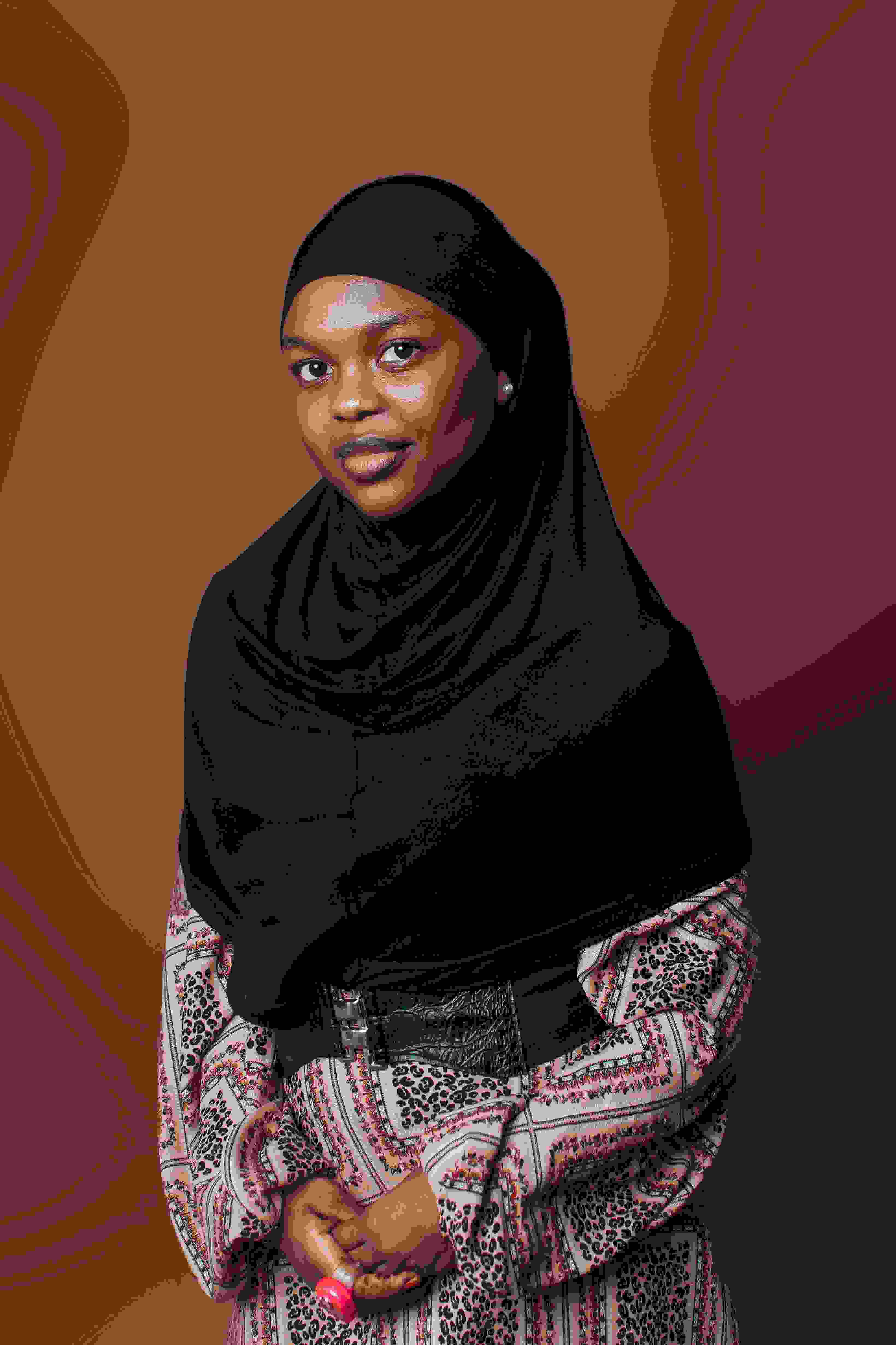 Headshot of Zainab, a happy customer